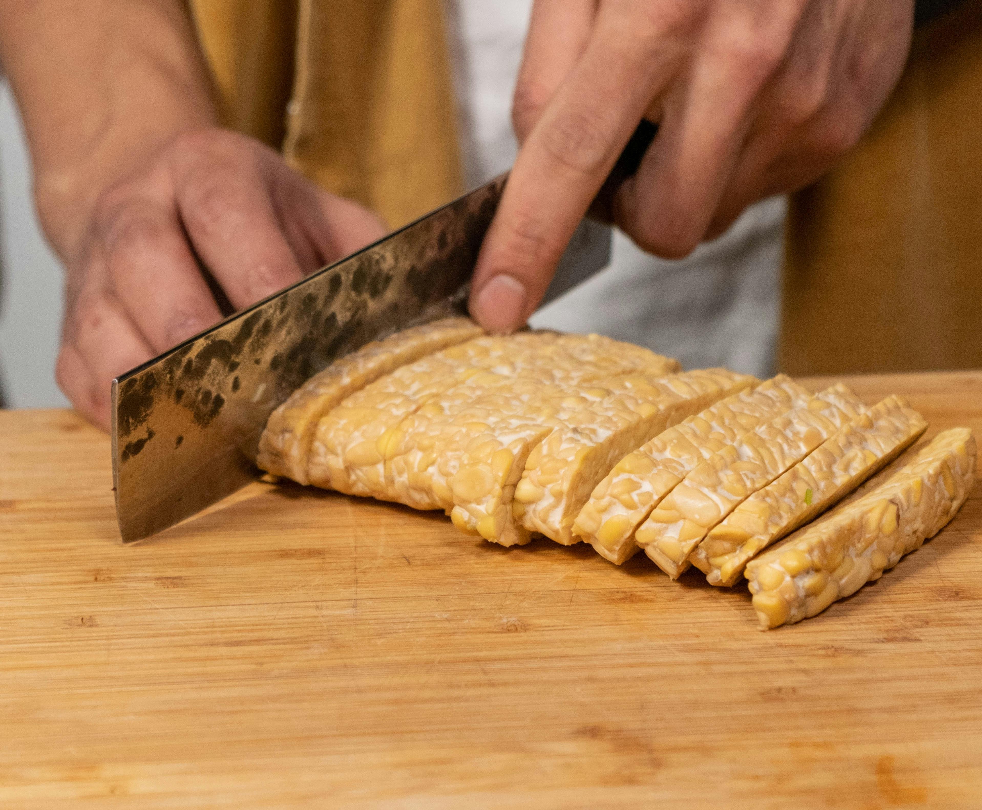 Tempeh being sliced